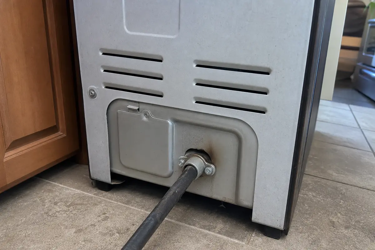 Rear range power cord strain relief checked for E310 power supply troubleshooting