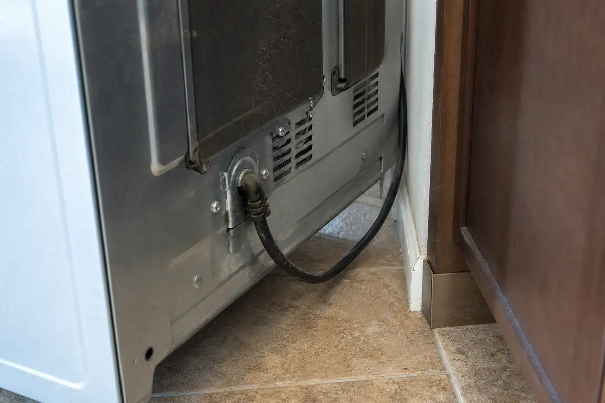 Range power cord routing behind a freestanding range checked after an E310 reset
