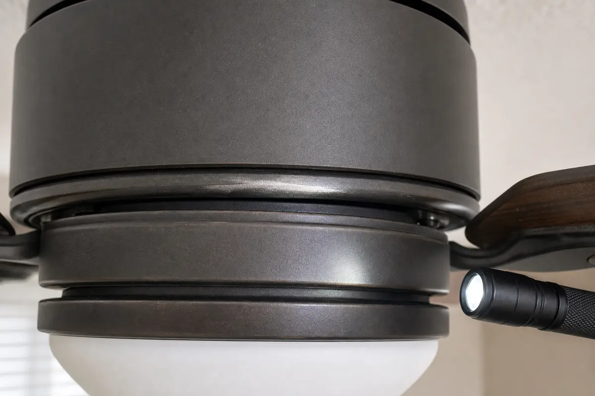 Ceiling fan lower housing rub mark checked for grinding noise