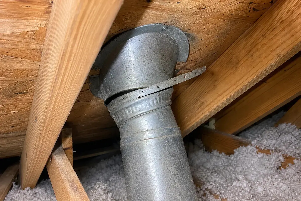 Roof source clue for a ceiling water stain near flashing or a roof penetration