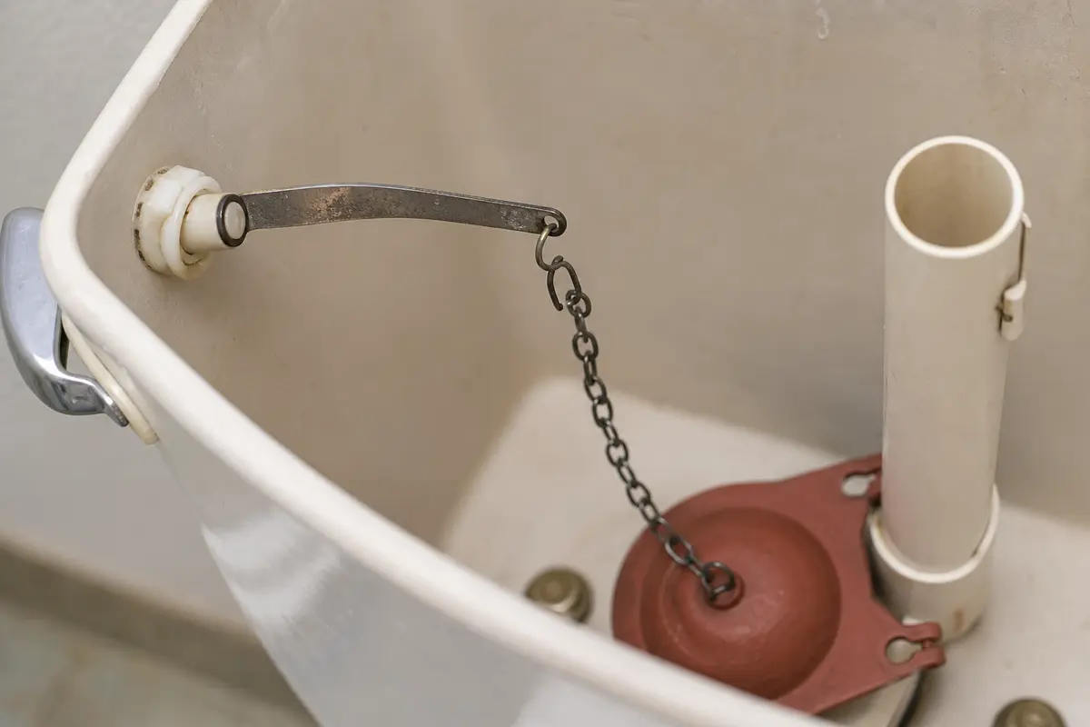 Toilet flapper chain routed badly and holding the flapper open after a flush