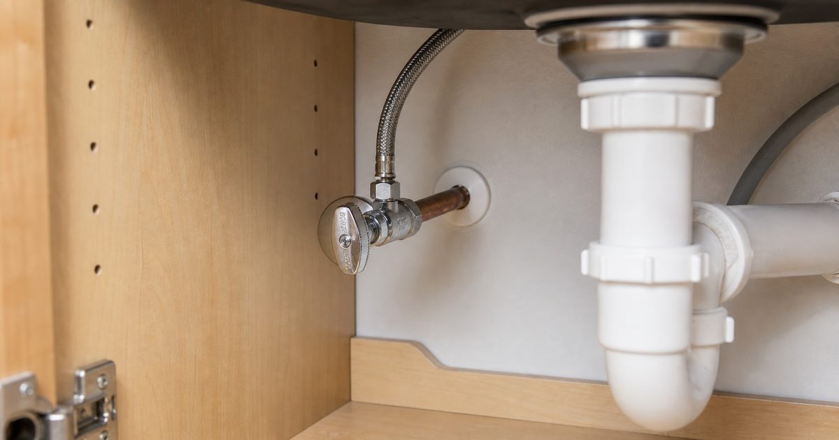 Under-sink angle stop shutoff valve connected to a supply line and pipe stub-out