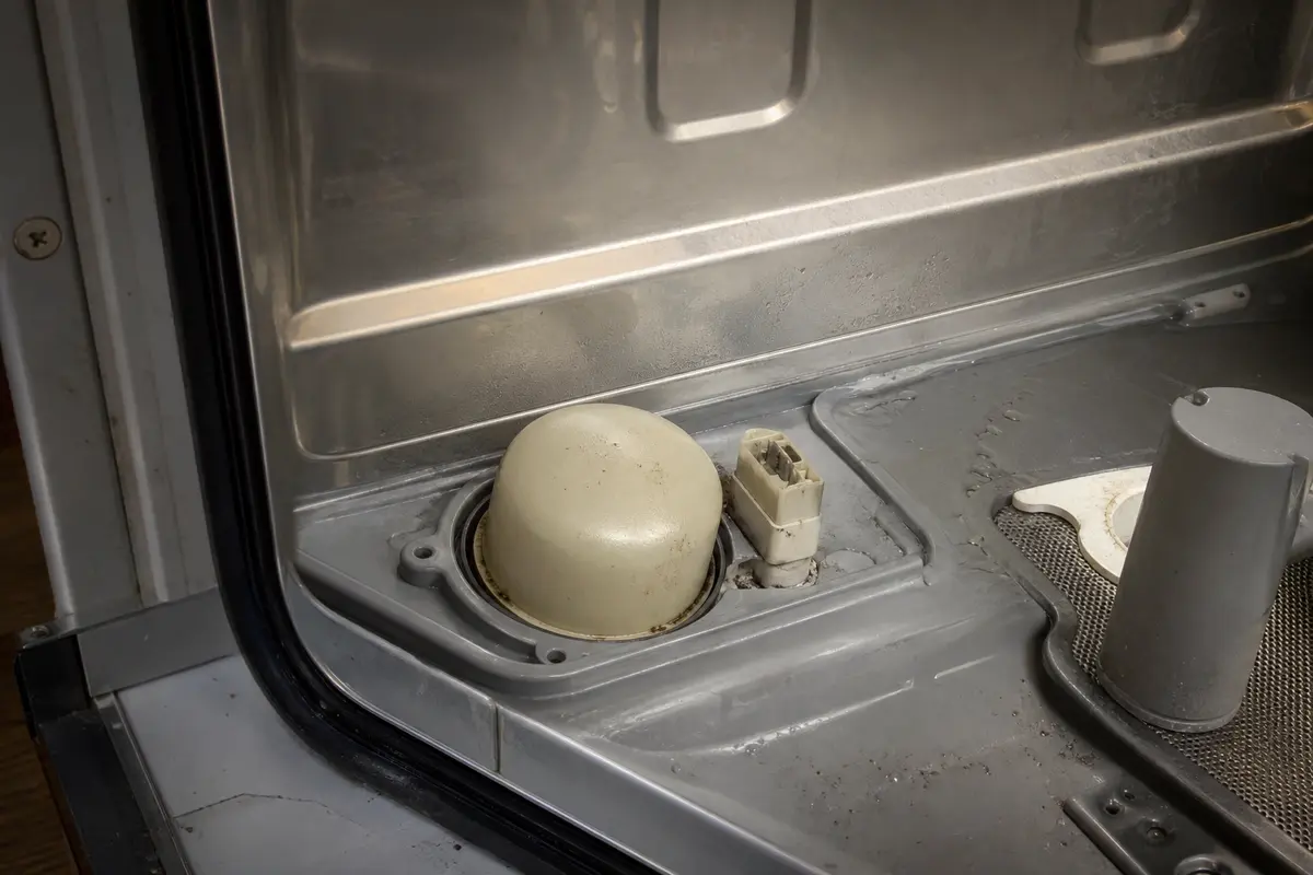 failed dishwasher float switch under the tub before replacement