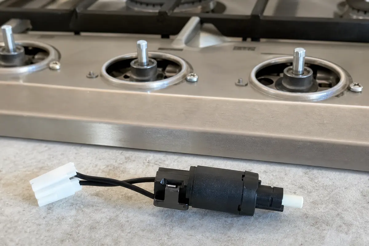 Cooktop ignition switch for cooktop burner keeps clicking