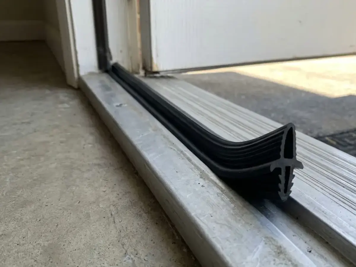 Exterior door sweep for door rubs at bottom