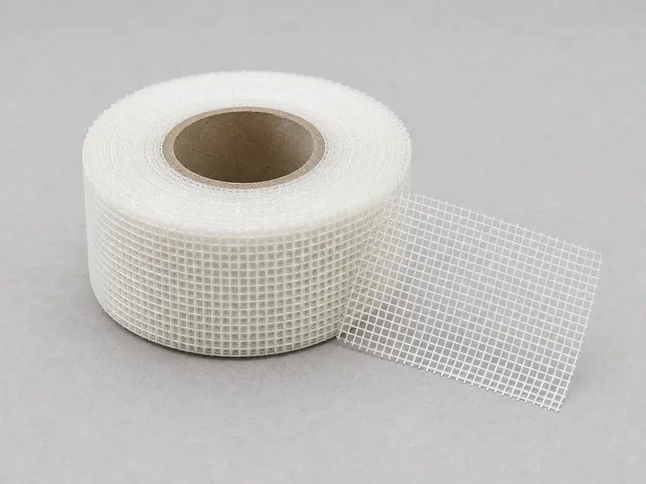 Drywall mesh tape roll with a short strip unrolled
