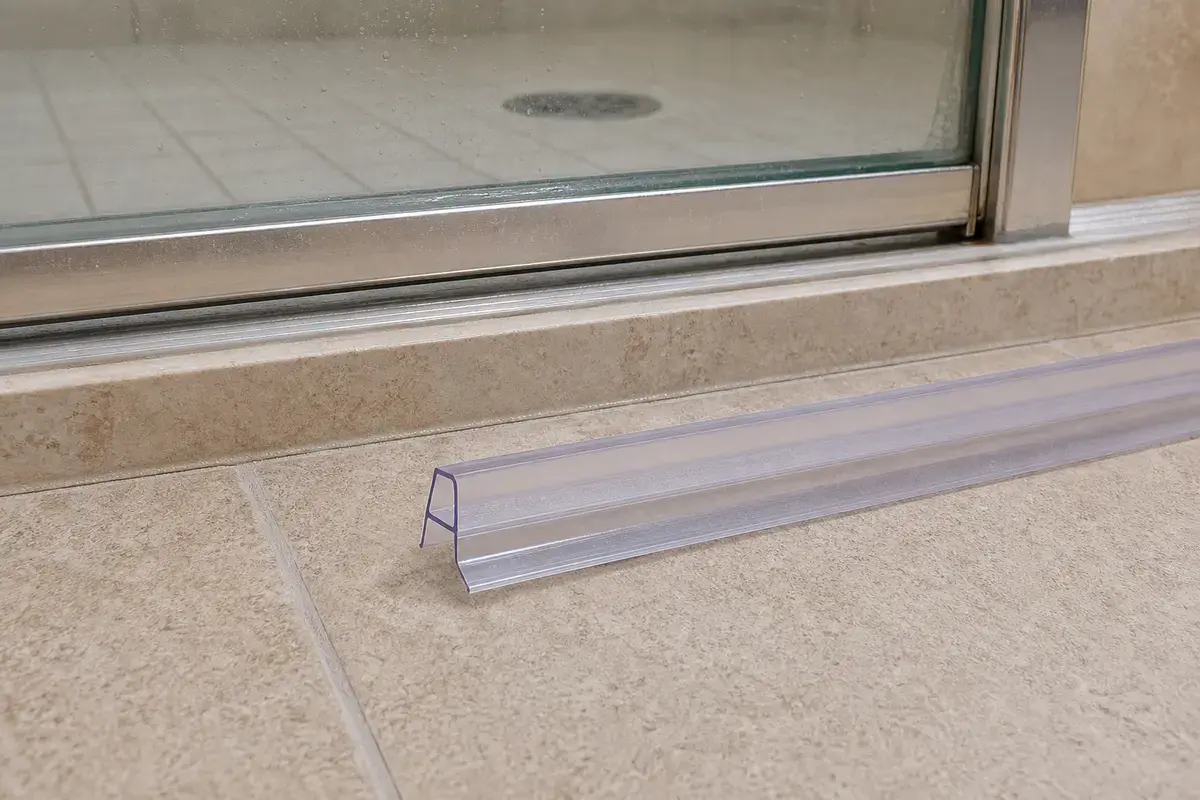Shower door sweep for shower leaking