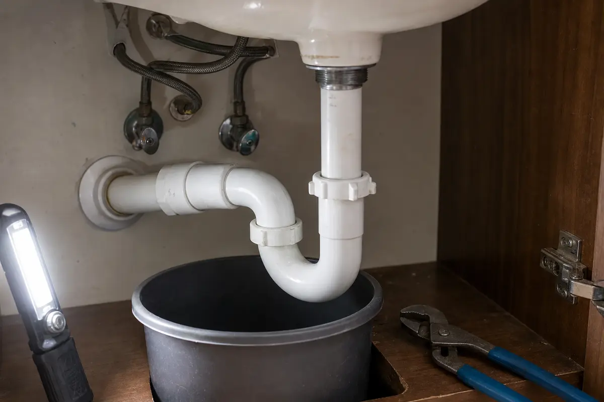 Sink P-trap inspection with bucket under the trap