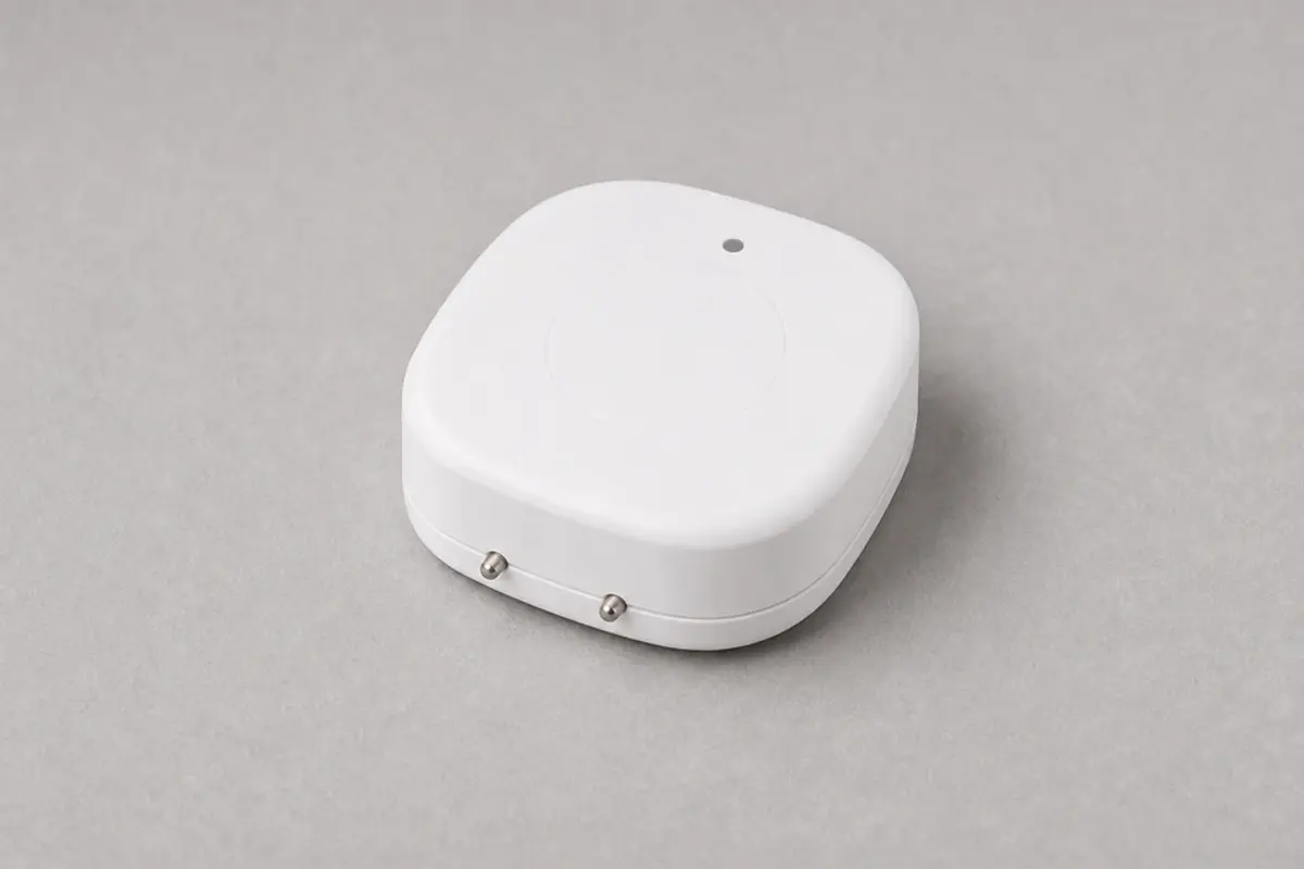 Water leak alarm placed on a basement floor after standing water cleanup