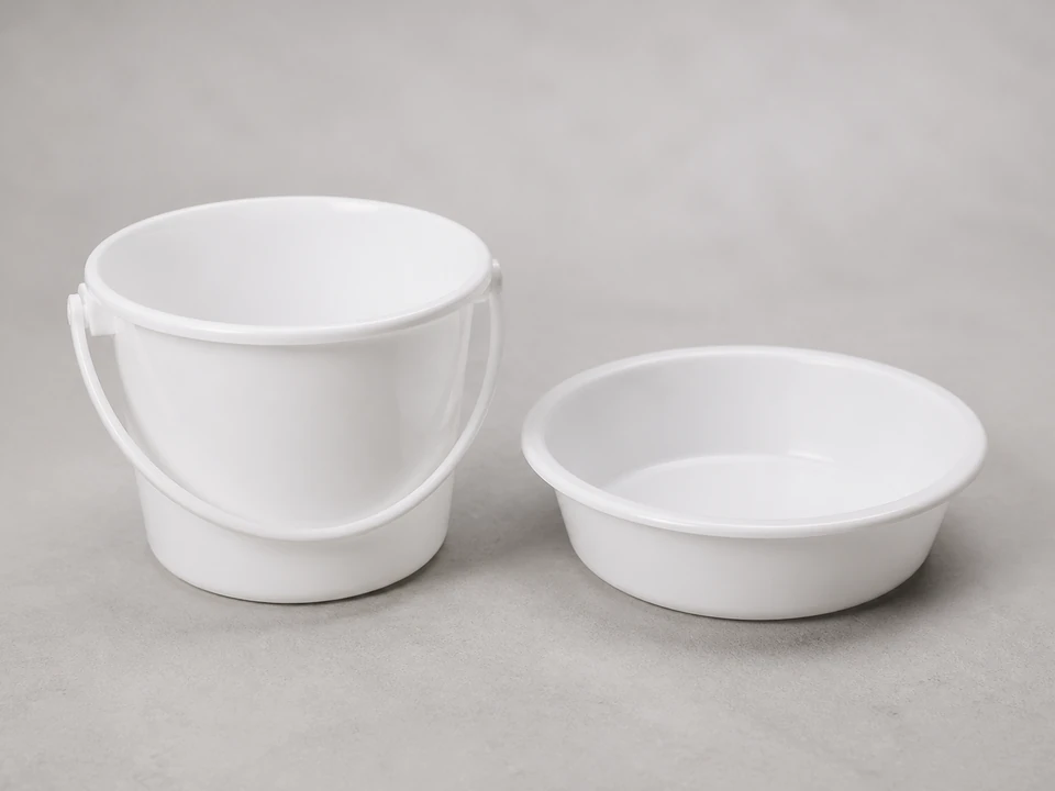 Small catch bowl positioned below a bathroom sink pivot nut