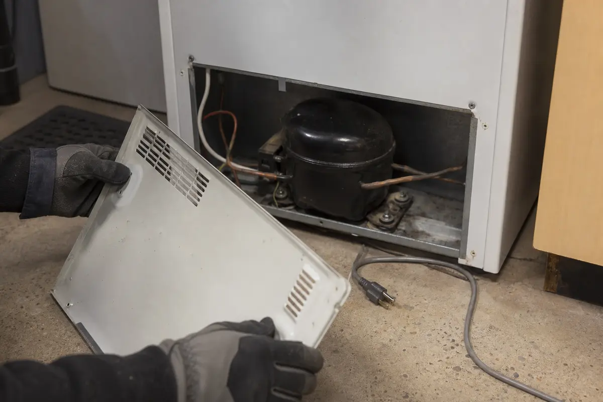 Work gloves shown in the repair area for danby chest freezer clicks but wont start