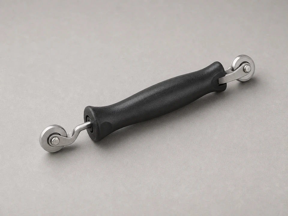 J-roller for pressing door flashing tape edges and overlaps