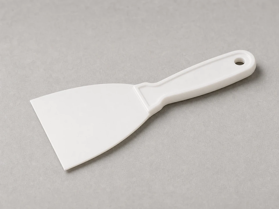 Plastic putty knife tool