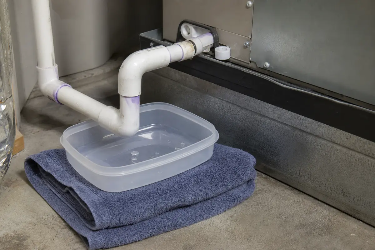 Small towel or shallow container for catching condensate near the switch