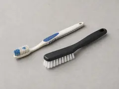 Old toothbrush or soft cleaning brush tool