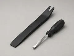 Small flat screwdriver or plastic pry tool tool