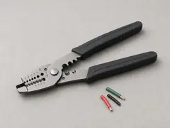 Wire stripper and crimper tool