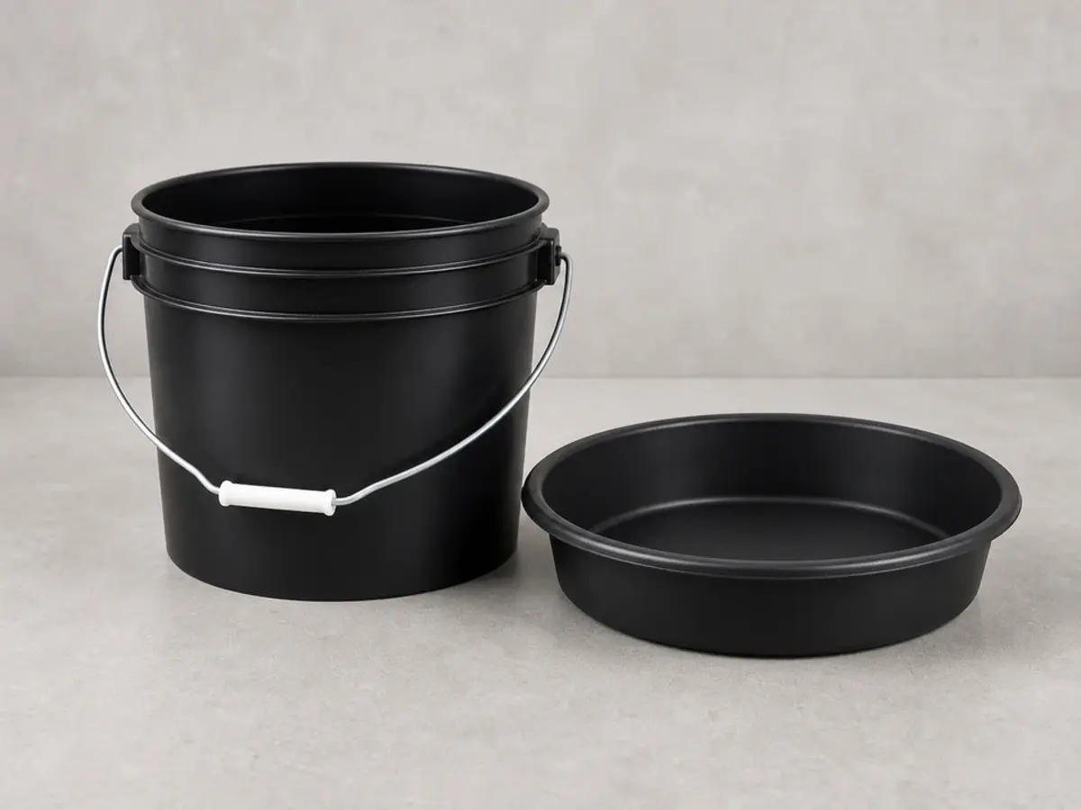 Bucket or shallow pan for catching water during water softener brine tank cleanup